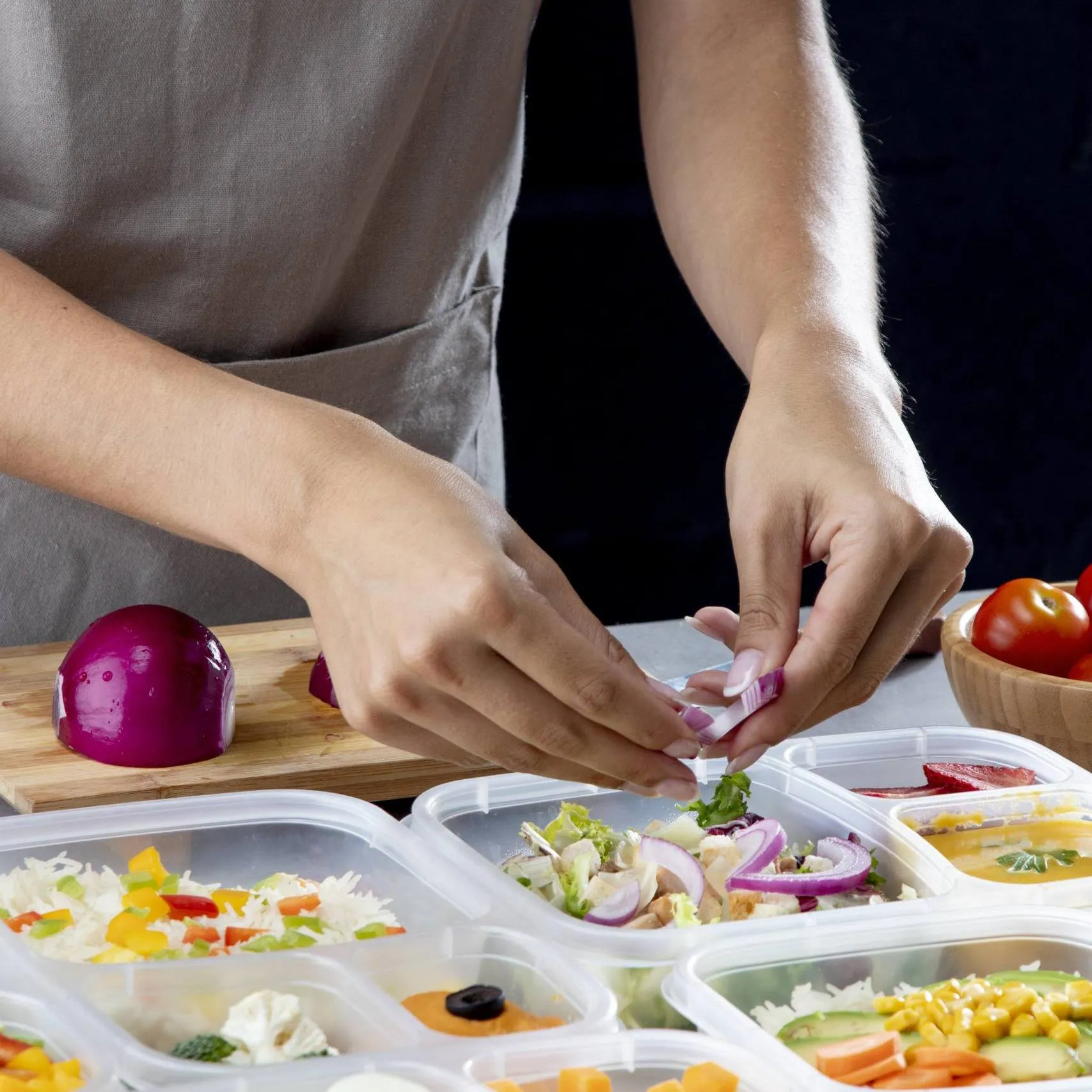 person practicing batch cooking with healthy food